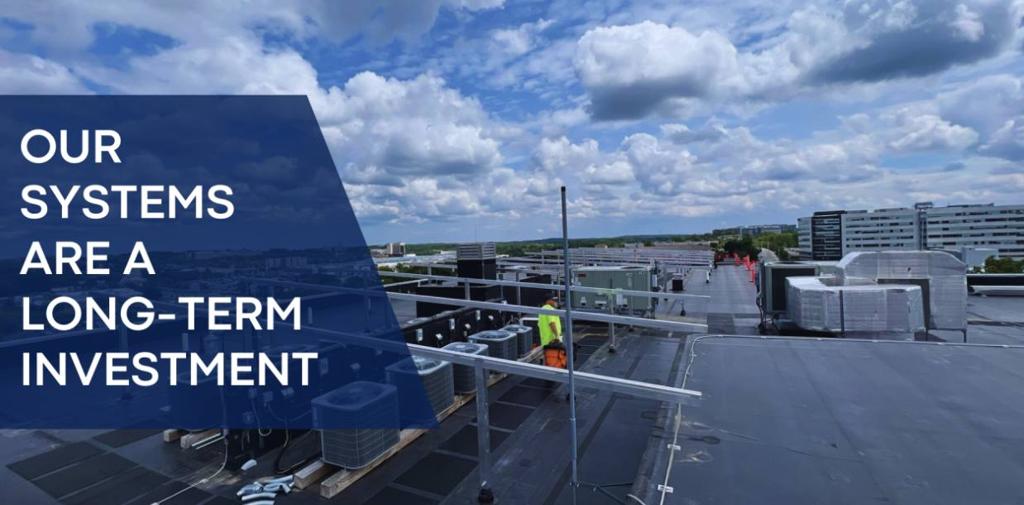 Banner reading Our Systems Are a Long-Term Investment, over a rooftop installation