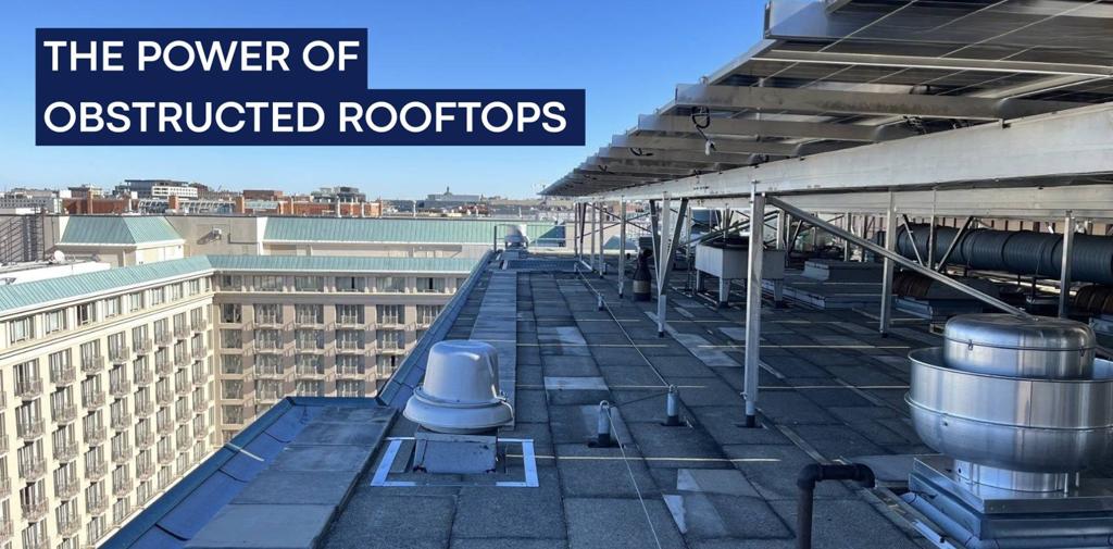 Banner reading The Power of Obstructed Rooftops, over a solar canopy above roof vents