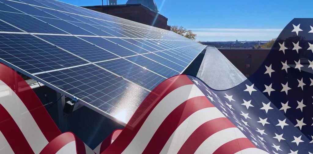 Rooftop solar panels with an American flag