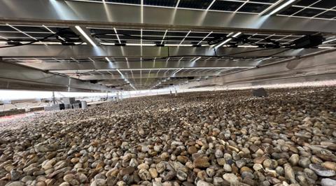 Flush mount solar array sitting low above the gravel roof at Washington Square
