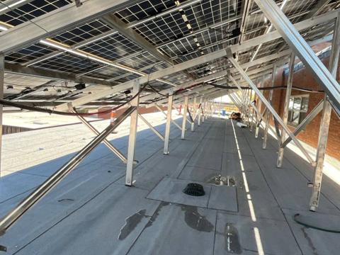 Racking supports beneath a tilted solar array