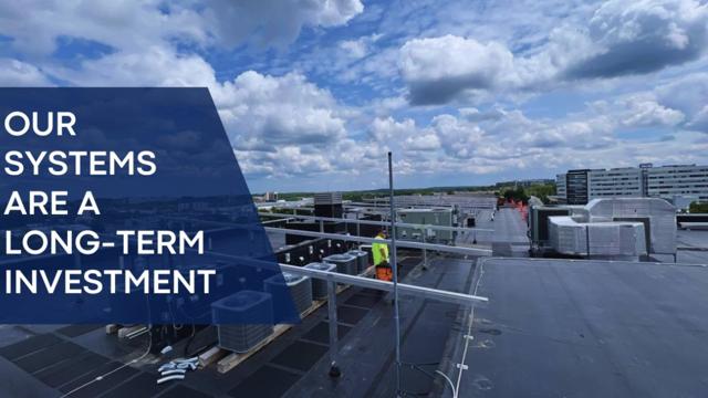 Banner reading Our Systems Are a Long-Term Investment, over a rooftop installation