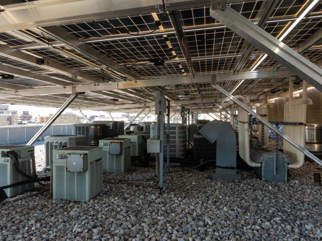 Rooftop HVAC condensers and ductwork under the solar canopy at 1441 Rhode Island Ave.