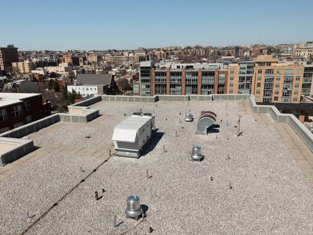 Roof of 1441 Rhode Island Ave. before the solar canopy, with vents and rooftop units in the open