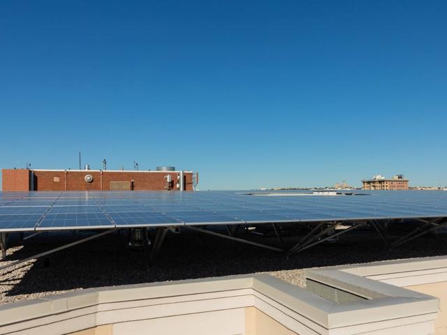 Solar array seen across the roof edge at 1441 Rhode Island Ave.