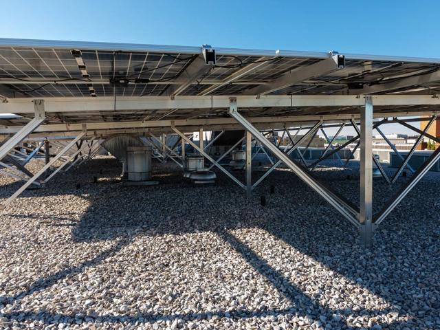 W System supports carrying bifacial solar panels over the gravel roof at 1441 Rhode Island Ave.