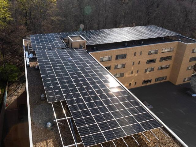 Aerial view of the L-shaped solar canopy on the roof of 3801 Connecticut Ave.