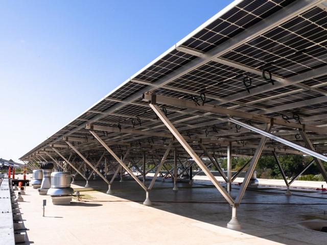 Solar canopy on aluminum supports above roof vents at 3801 Connecticut Ave.