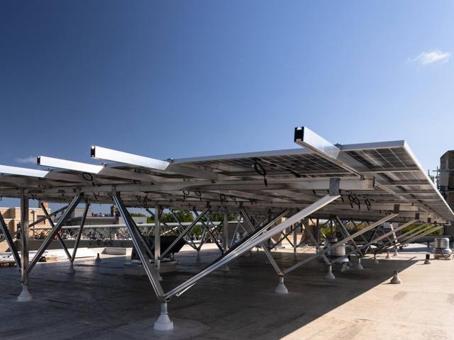 Elevated W System racking carrying solar panels on the roof of 3801 Connecticut Ave.