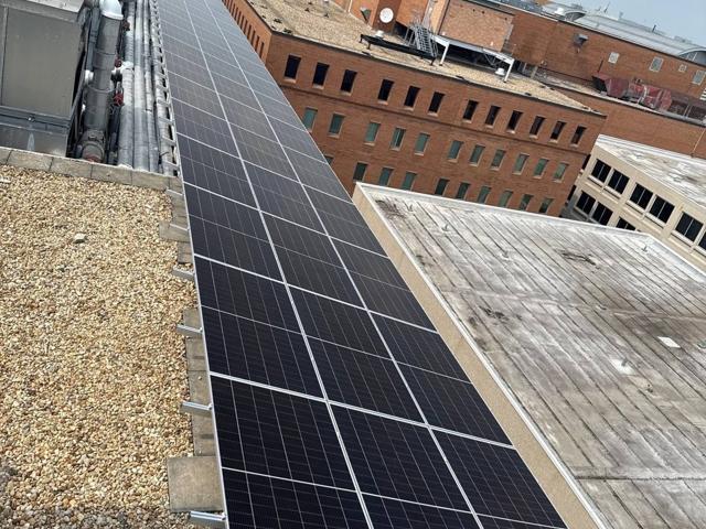 Narrow solar array along the roof edge at 616, seen from above