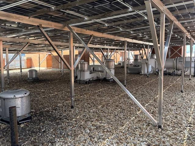 Roof exhaust fans beneath the solar canopy at 616