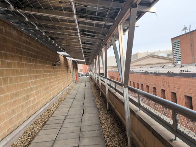 Solar canopy over a roof walkway at 616