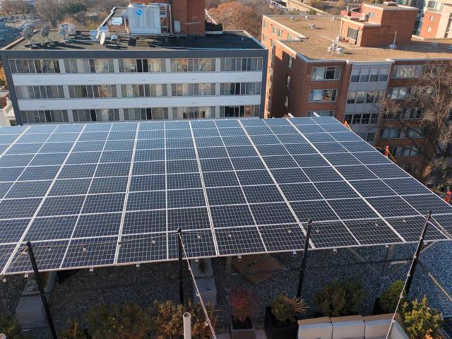Aerial view of the solar canopy at 925, with neighboring buildings