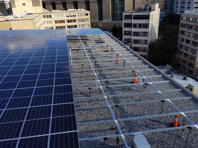 Solar canopy at 925 partly paneled during installation