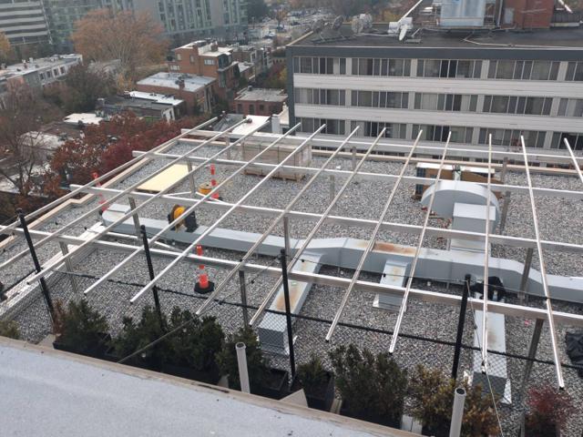 Racking frame over rooftop ducts at 925, before the panels
