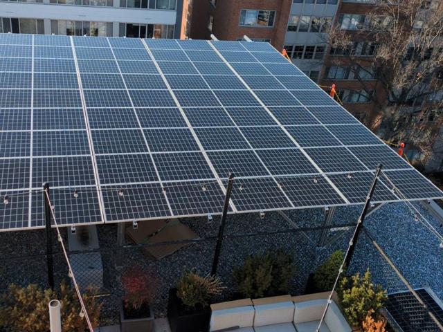 Edge of the solar canopy above a roof terrace at 925