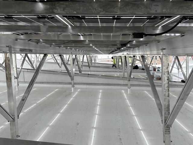 Elevated Flush Mount supports over a white roof