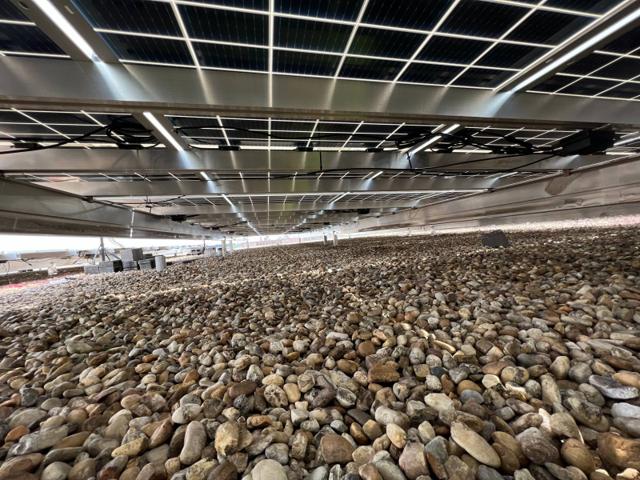 Flush Mount solar array sitting low above a gravel roof