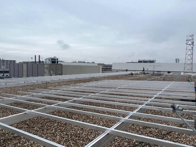 Flush Mount racking rails on a gravel roof before the panels