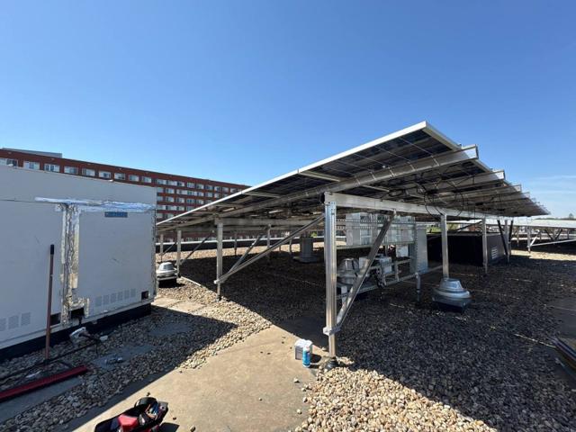 Solar canopy beside a rooftop air handling unit at GRP