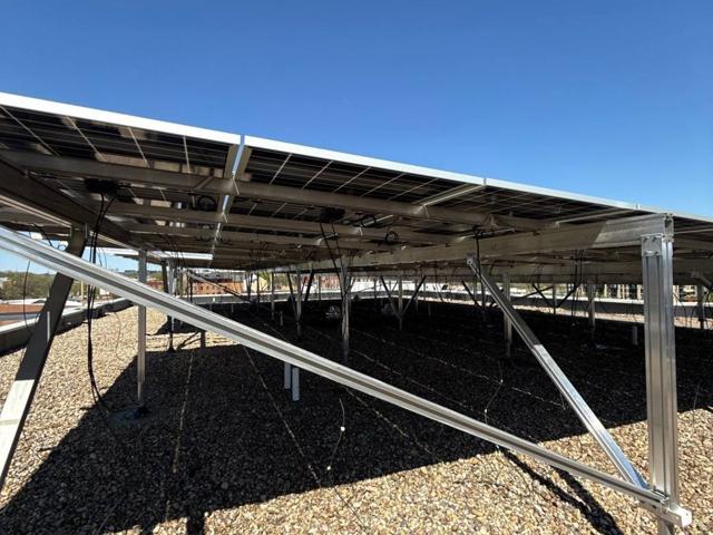 Bracing beneath the solar canopy at GRP