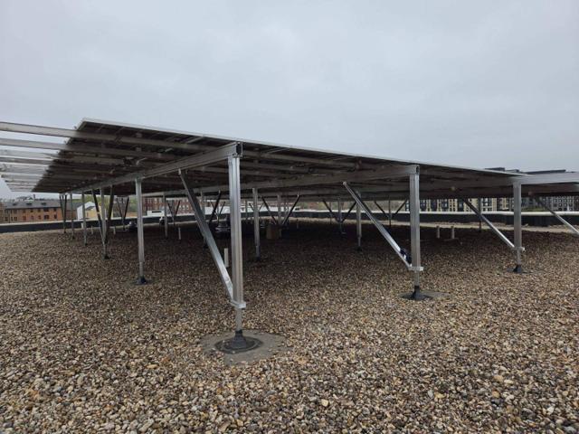 Solar canopy on posts over the gravel roof at GRP