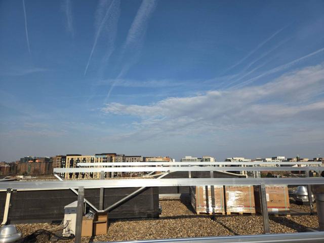 Racking frame and pallets of materials on the roof at GRP