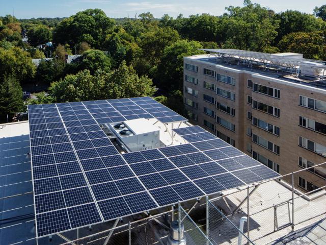 Aerial view of the solar canopy at Kenmore, with an opening around a rooftop unit