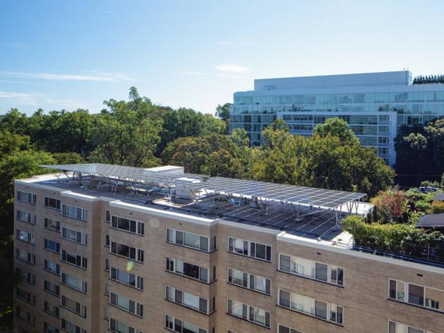 Kenmore apartment building with its rooftop solar canopy