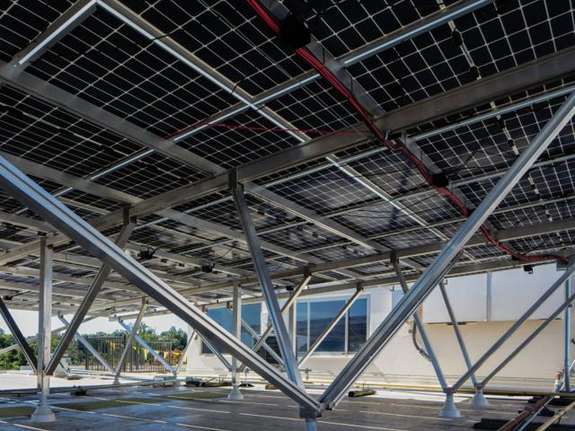 Underside of the solar canopy at Kenmore, showing W-shaped bracing