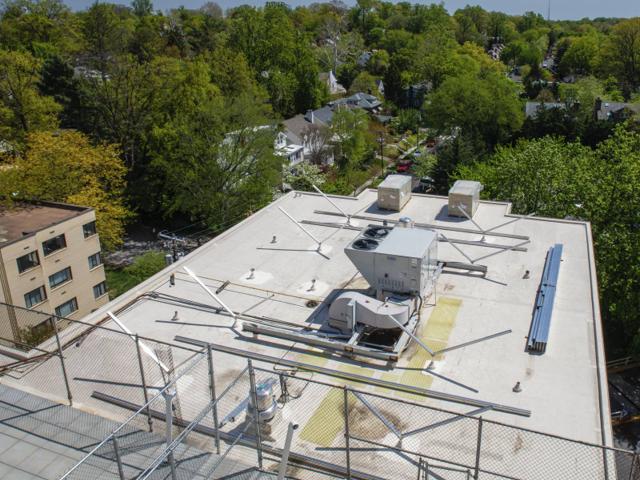Racking frame built around a rooftop unit at Kenmore during installation