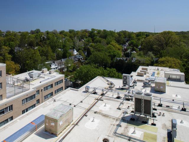 Roof of Kenmore before installation, crowded with HVAC units