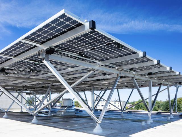 Elevated solar canopy on W-shaped supports at Kenmore, seen from below