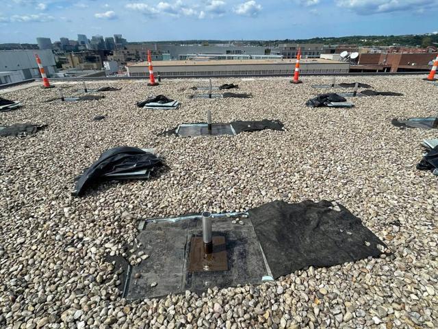 Gravel roof of Lafayette with attachment points marked before racking