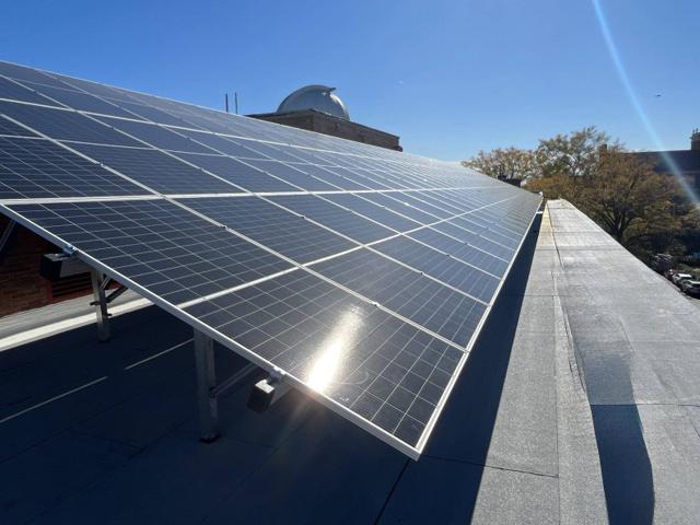 High tilt solar array along the roof edge at Locke Hall
