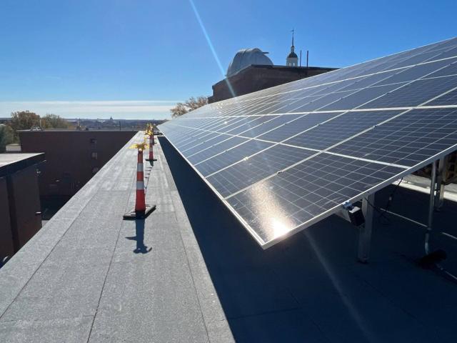 High tilt solar array beside the roof walkway at Locke Hall
