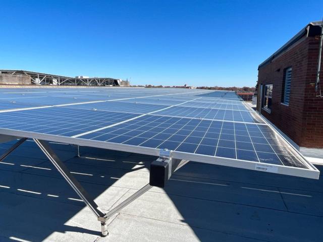 Edge of the solar canopy over the newly replaced roof at Locke Hall