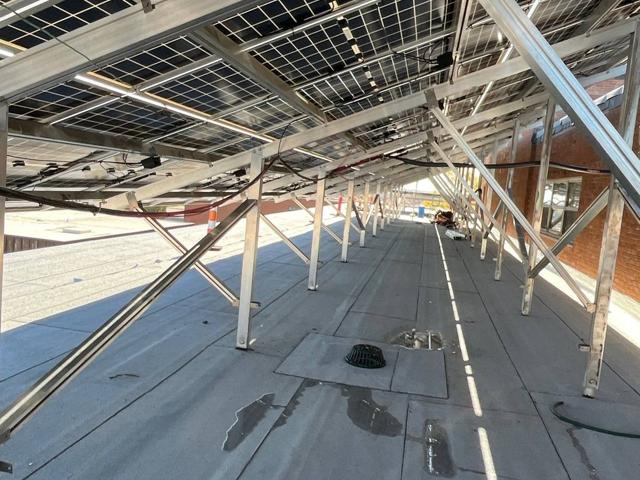 Racking supports beneath a tilted solar array