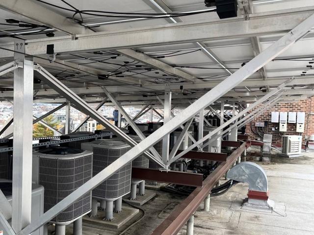Condenser units beneath the solar canopy at Randolph Towers