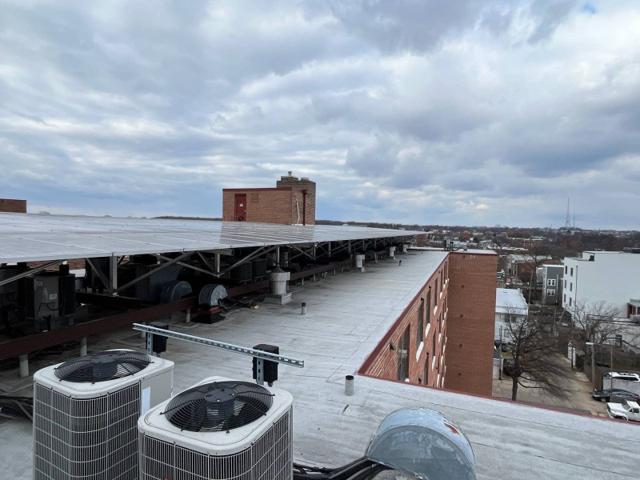 Solar canopy over the condenser units along the roof of Randolph Towers