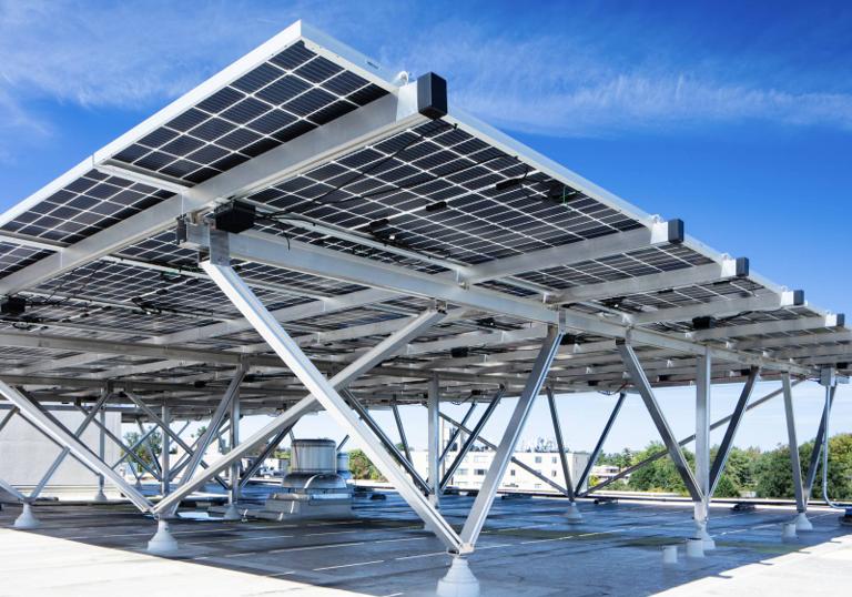 Elevated solar canopy on W-shaped supports at Kenmore, seen from below