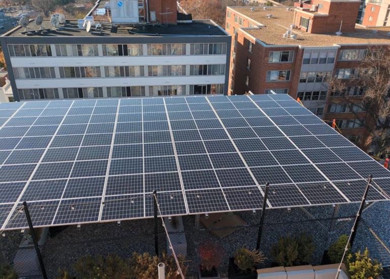 Aerial view of the solar canopy at 925, with neighboring buildings