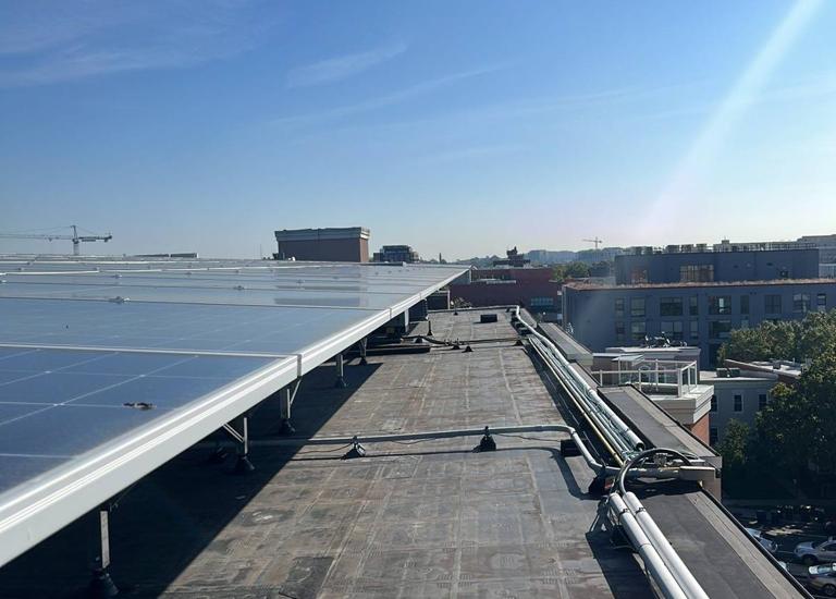 Solar canopy along the roof edge at Logan Station