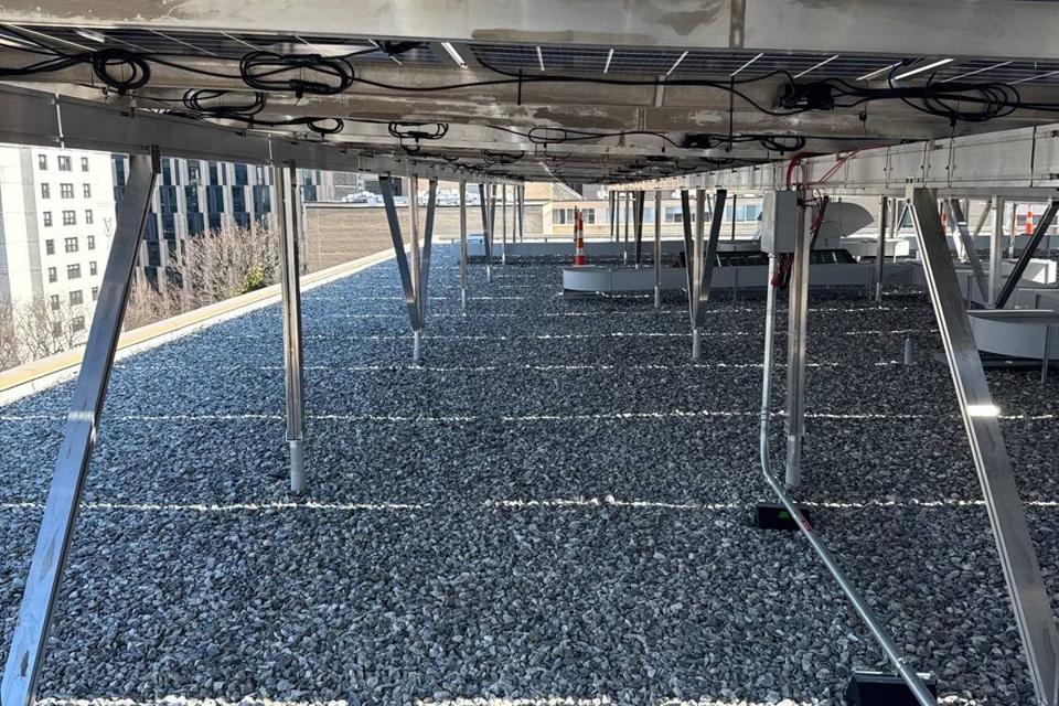 Beneath the solar canopy over the gravel roof at 925
